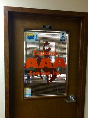 The door to Suite 202 bears the sign and logo for AAA Corporate Services Inc., which serves as M.F. Corporate Services Wyoming LLC's registered agent, according to state financial records.