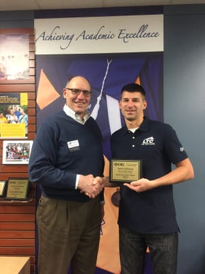 Lakeshore Technical College PTK member Jason Schema, left, poses with LTC President Michael Lanser. Schema received second place Distinguished Member Award.