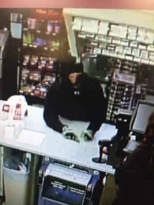This security image released by the Sparks Police Department shows a suspect wanted in a Saturday morning armed robbery.