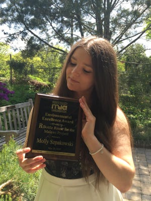 Morris Catholic High School sophomore Molly Szpakowski with the 2016 Morris County Environmental Excellence Award.