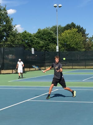 Blue River No. 1 singles Donnie Lamberson rallies at Cardinal Creek tennis courts in Muncie, Indiana. Lamberson said in a release that the Smash Cancer event will be important to him because he lost his grandfather to lymphoma.