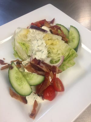 Chef Shawn Calley's wedge salad is made with homemade blue cheese dressing, which includes Jasper Hill Farm's Bayley Hazen Blue cheese.