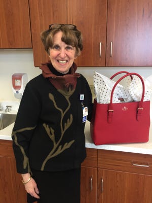 Deaconess President and CEO Linda White dropped off her Go Red handbag. The red Kate Spade tote is filled with a variety of fun clothing items including several scarves, a sweater, tights and a collection of Brighton accessories. It'll be up for auction during the luncheon.