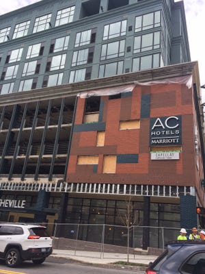 The AC Hotel facade will be getting some finishing touches in the coming weeks, including metal coverings over the concrete, metal mesh over  the window holes and some ornate railings.