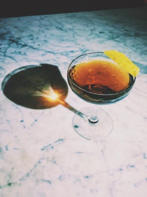 The house shot at Meta - verdita and aged rum - was directly influenced by travels to Chicago.