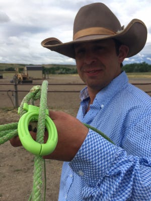 Pendroy rancher Ben Collins shows a new breakaway roping honda he developed with partner Ty Lidstrom.