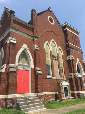 The exterior of the old Trinity AME Zion Church was quiet Tuesday afternoon, but inside workers were getting things ready for Friday and Saturday's public sale.