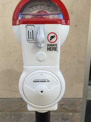 Parking meters in front of businesses in Downtown Indianapolis let you donate to services that help the homeless in the Know Outlets campaign.