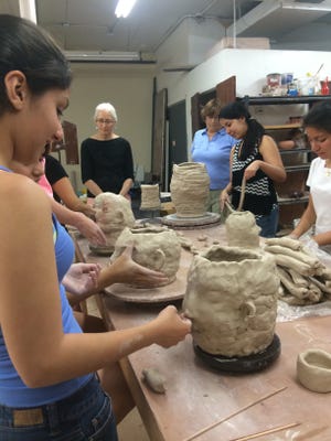Port Chester Middle School students participate in the Around the World in Clay Program at the Clay Art Center with visiting artist Claudia Alvarez. The center seeks to raise awareness of local hunger and to support the Interfaith Soup Kitchen in Port Chester.