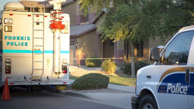 The investigation continues Oct. 17, 2016, into what officials are calling a murder-suicide of a Phoenix father and his two daughters.