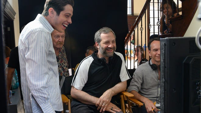 Pete Davidson (left) looks on as Judd Apatow checks out a scene from their new film.
