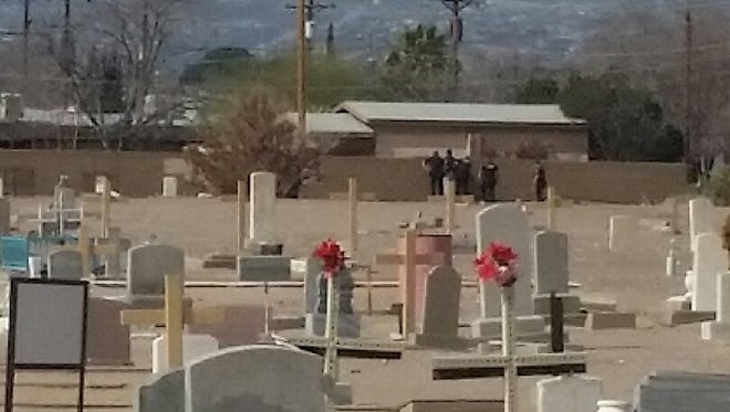 Las Cruces police are seen detaining a man Sunday, Feb. 18, 2018 who is believed to have brandished a toy gun during Mass at nearby St. Genevieve Church.