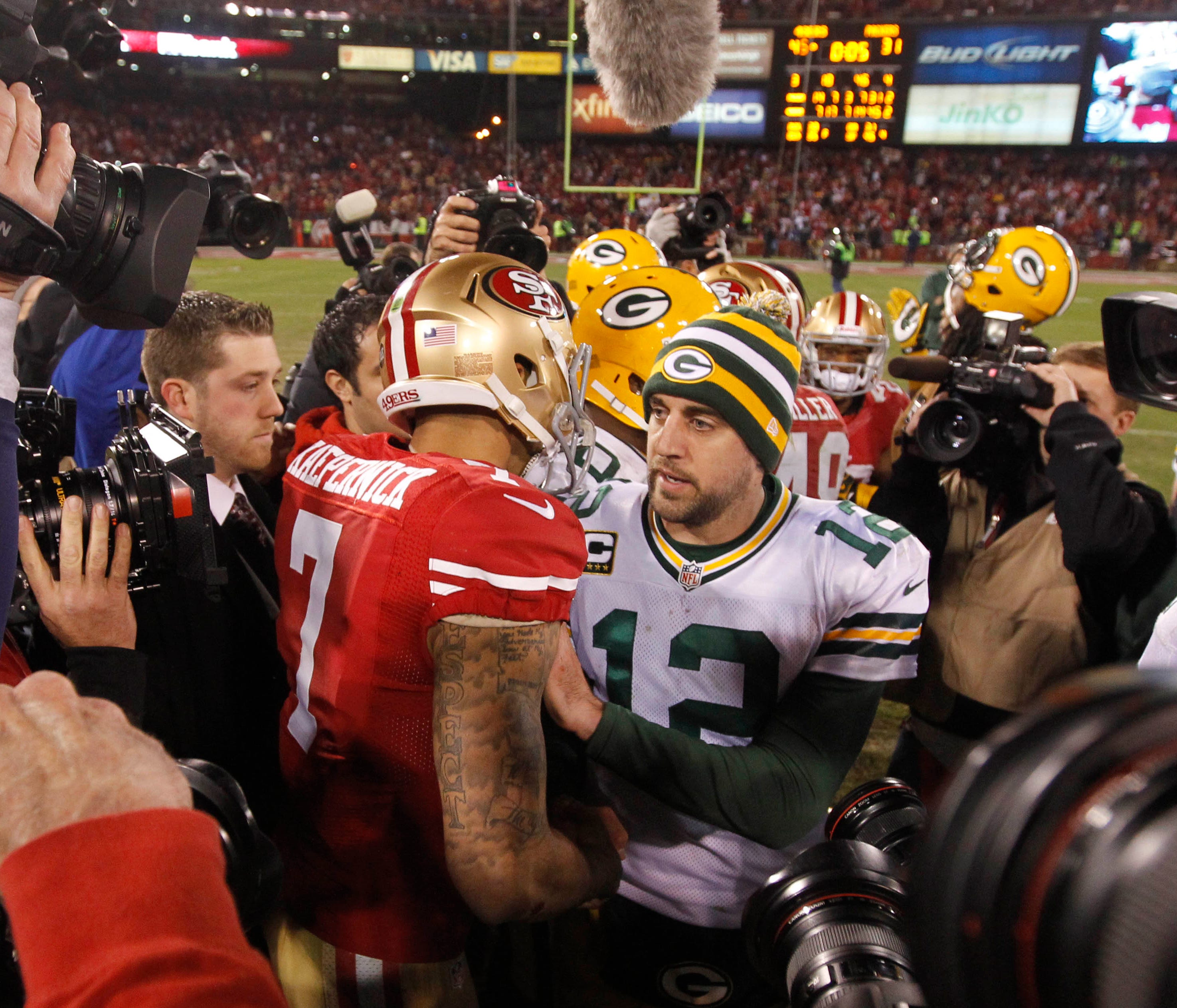 Jan 12, 2013; San Francisco, CA, USA; Green Bay Packers quarterback Aaron Rodgers (12) congratulates San Francisco 49ers quarterback Colin Kaepernick (7) after the NFC divisional round playoff game at Candlestick Park.  The 49ers defeated the Packers