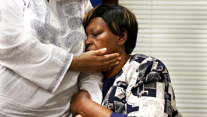 Audrey DuBose, is comforted by her daughter, Terina Allen as other family address the media after Hamilton County Prosecutor Joe Deters charged University of Cincinnati police officer Ray Tensing.