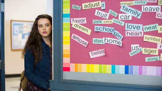 This image released by Netflix shows Katherine Langford in a scene from the series, "13 Reasons Why," about a teenager who commits suicide.