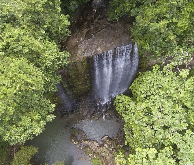 Visitors must make a 30-minute hike through plantation fields to reach Mt. Carmel Waterfall.