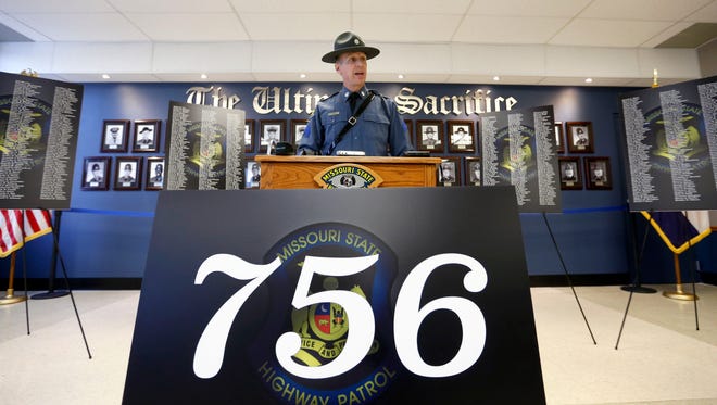 Missouri State Highway Patrol Sergeant Jason Pace stands in front of a sign with the number of traffic fatalities in Missouri in 2015 during a press conference about the rise in deaths on Missouri's roads on Tuesday, Nov. 24, 2015.