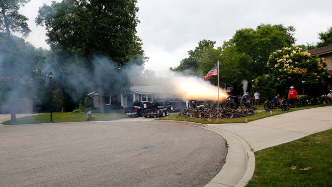 A Civil War cannon fires a Fourth of July salute to the nation at the Greenfield home of Frank Markel in 2016.