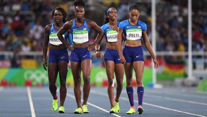 Tianna Bartoletta , Allyson Felix , English Gardner and Morolake Akinosun (USA) after the women's 4x100m relay heats in the Rio 2016 Summer Olympic Games at Estadio Olimpico Joao Havelange.