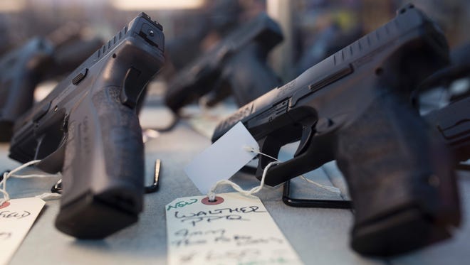 Handguns are for sale at a gun shop in Merrimack, N.H.