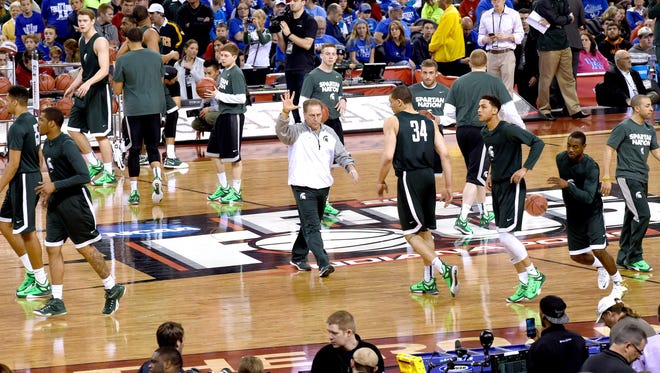Tom Izzo and his Michigan State Spartans take the Lucas Oils Stadium court during practice in Indianapolis Friday, April 3, 2015.