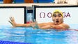 Guangyuan Li (CHN) reacts after the men's 200-meter