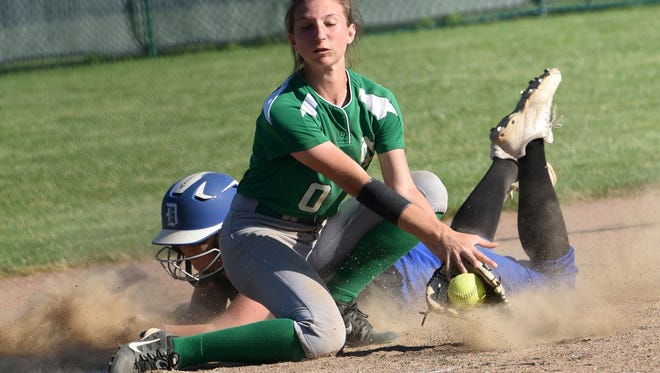 Newark Catholic third baseman Amelia O'Neill gets the ball to late to tag out a Danville runner during Monday nights game at Pickerington Central. The Green Waves fell  10-0 in six innings in the Division IV district semifinal. 