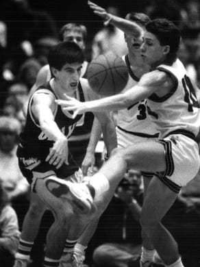 1988: A pass tossed by Oelwein's Tony Meyer (left) is kicked by Sean Greenwalt of Cedar Rapids LaSalle.