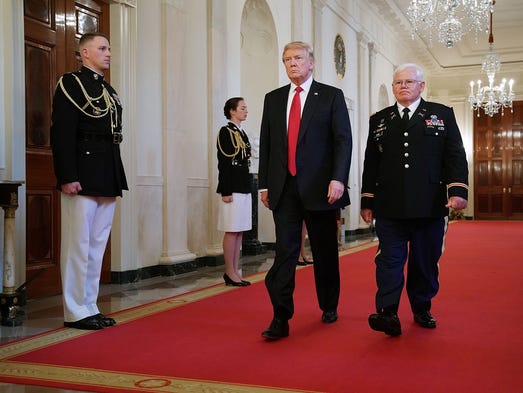 President Trump and retired Army Capt. Gary Rose walk