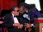 Muhammad Ali is greeted by the Arizona Cardinals' Larry Fitzgerald during the Celebrity Fight Night event in 2012.