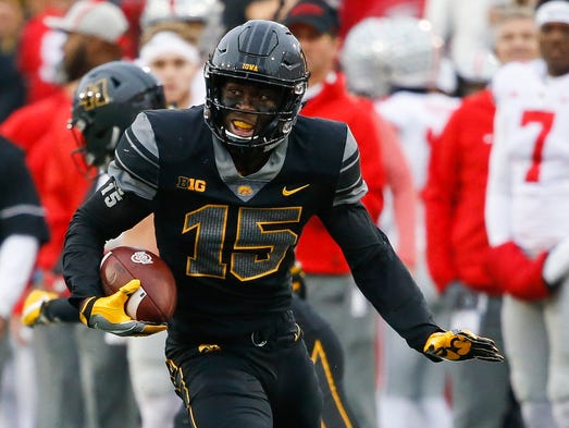 Iowa defensive back Josh Jackson returns an interception