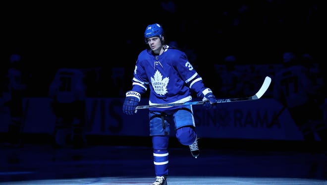 Nov 25, 2017; Toronto, Ontario, CAN; Toronto Maple Leafs center Auston Matthews (34) skates in the spotlight moments before the start of their game against the Washington Capitals at Air Canada Centre. The Capitals beat the Maple Leafs 4-2.