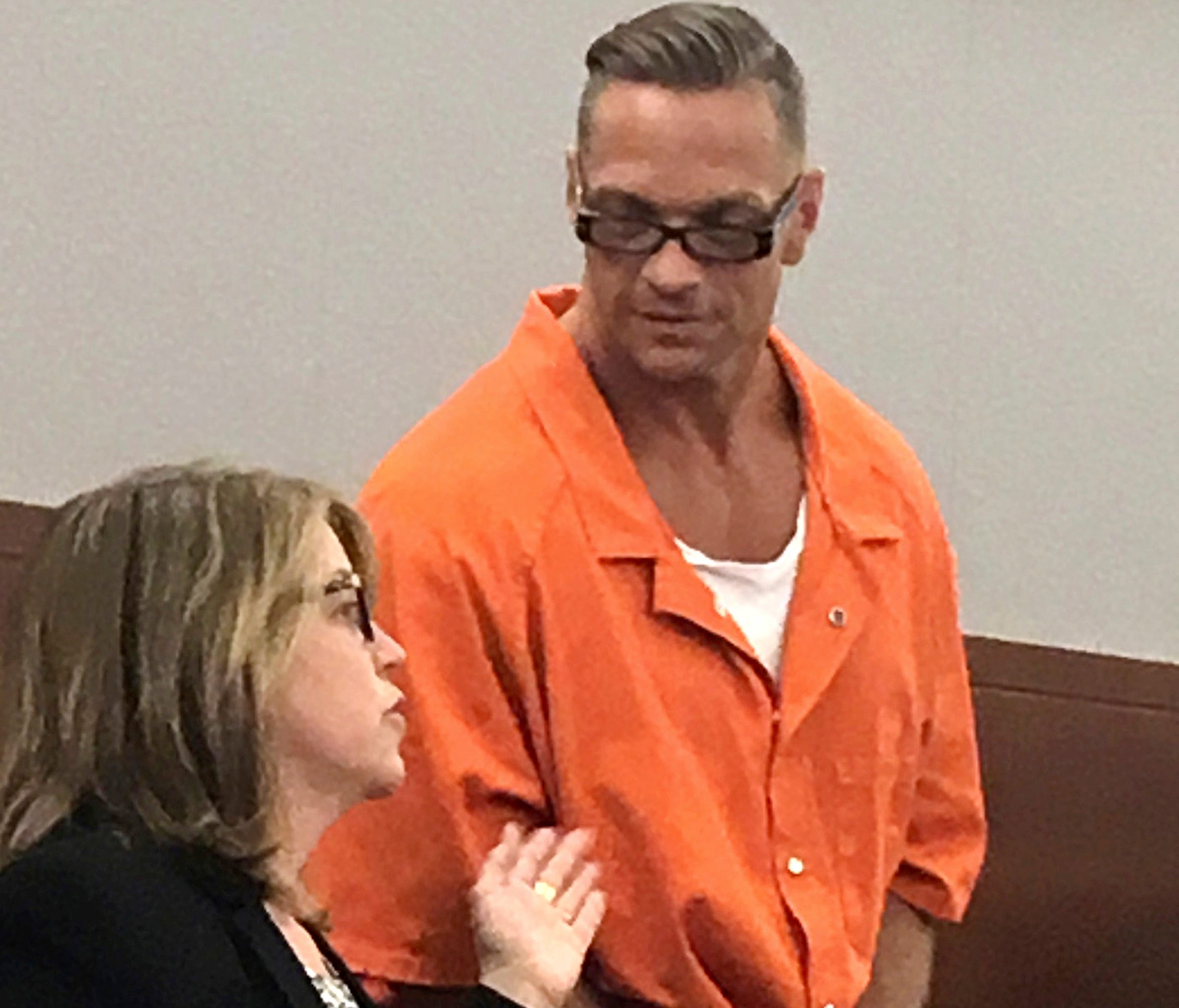 Nevada death row inmate Scott Raymond Dozier confers with Lori Teicher, a federal public defender involved in his case, during an appearance in Clark County District Court in Las Vegas.