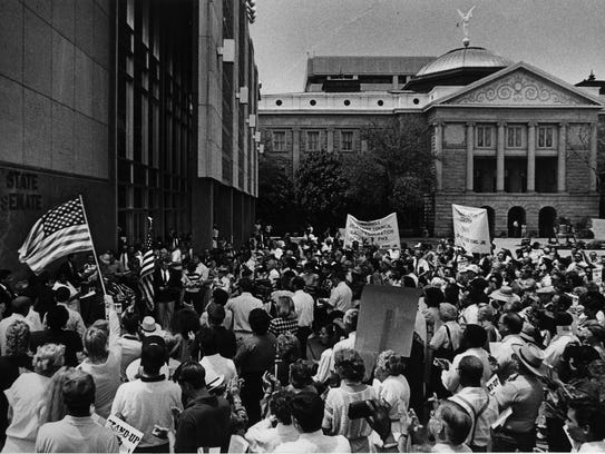 Crowds rally for a Martin Luther King Jr. holiday at the Arizona State Capitol in 1988.
