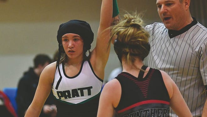Pratt freshman Jadyn Thompson (hand raised) has made an impressive debut on the high school stage, securing her rank as number four in the state for 4A. She won all of her matches by fall at the Dodge City Tournament.