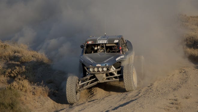 Southern California's Shelby Reid takes a turn in the desert near Fallon, Nevada during the Best in the Desert - Las Vegas to Reno Off Road Race on Friday afternoon, August 19, 2011.