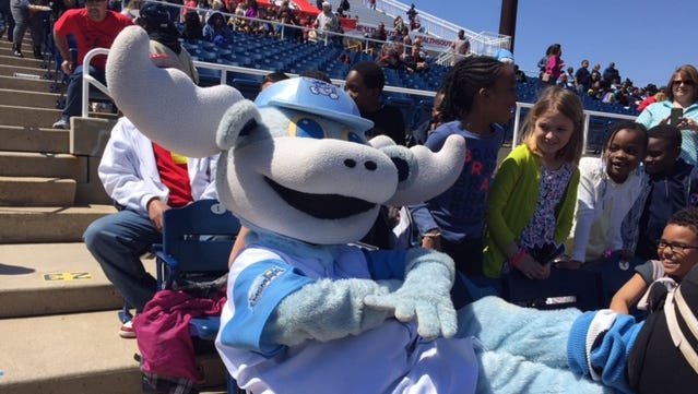 Mascot Rocky Bluewinkle reclines in the Frawley Stadium seats with Southern Elementary School students Wednesday.