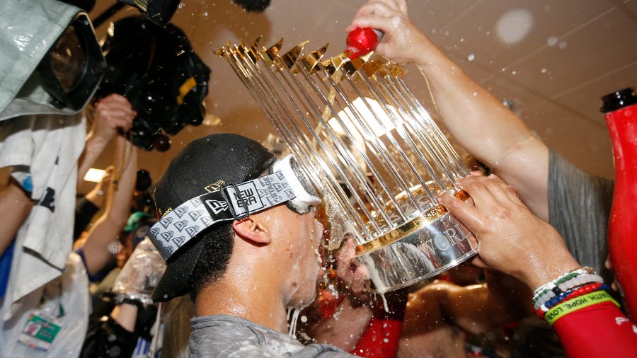HOUSTON, TEXAS - OCTOBER 30:  Juan Soto #22 of the Washington Nationals celebrates in the locker room after defeating the Houston Astros in Game Seven to win the 2019 World Series at Minute Maid Park on October 30, 2019 in Houston, Texas. The Washington Nationals defeated the Houston Astros with a score of 6 to 2. (Photo by Elsa/Getty Images) ORG XMIT: 775425081 ORIG FILE ID: 1184550629