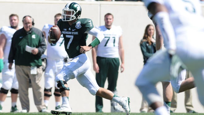 Tyler O'Connor (7) has emerged as MSU's most likely starting quarterback this fall. That was more clear than ever after Saturday's spring game at Spartan Stadium.