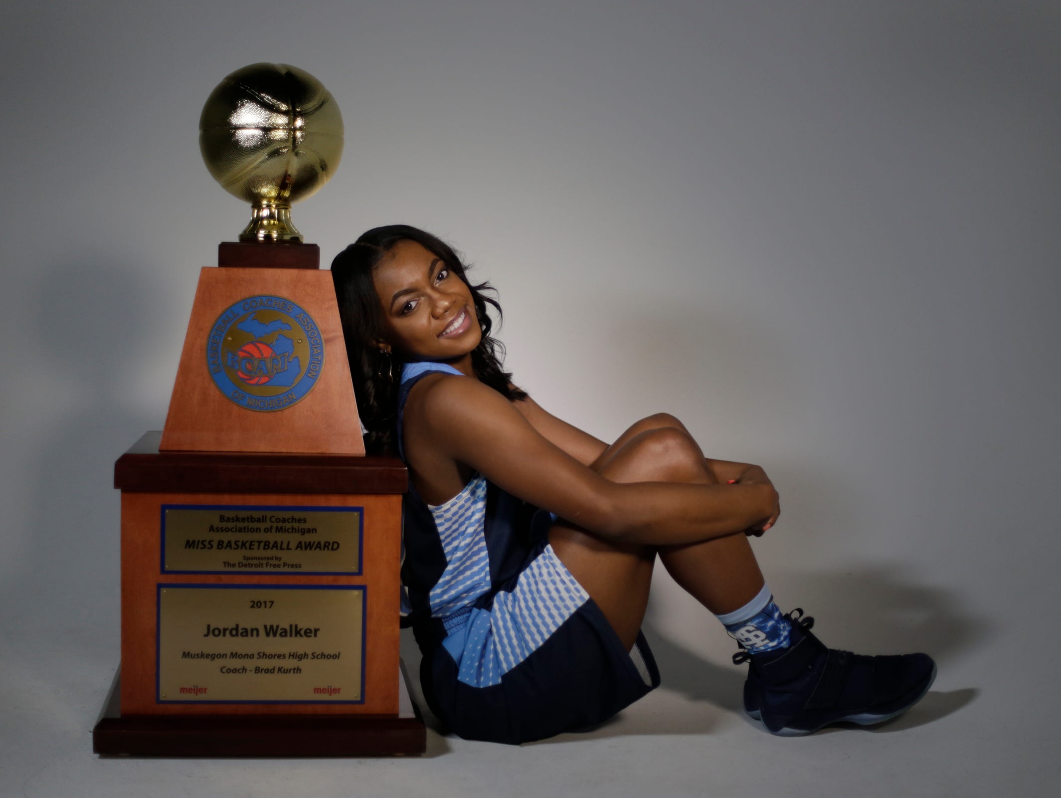 Jordan Walker from Mona Shores High School in Muskegon, was named the 2017 Miss Basketball Monday March 13, 2017. She poses with her trophy at the Detroit Free Press.