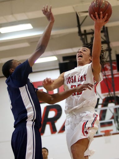 Wauwatosa East's Jalen Holley shoots over Racine Park's