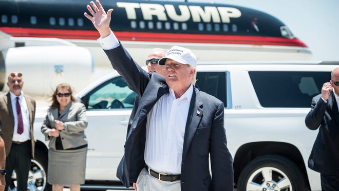 Donald Trump exits his plane during his trip to the border on July 23, 2015, in Laredo, Texas.