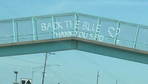 This message was written on the Campbell Avenue footbridge on Tuesday.
