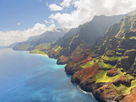 The 17-mile stretch of emerald cliffs on Kauai's coast has become one of Hawaii's most famous sights. The Napali Coast can only be accessed on land by the Kalalau Trail.