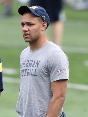 Michigan player Grant Perry works with high school players during the Michigan Football Elite Camp on June 23, 2017, at Michigan Stadium.