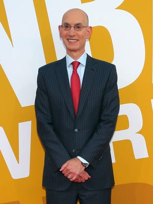 NBA commissioner Adam Silver poses for photos on the red carpet before the 2017 NBA Awards.