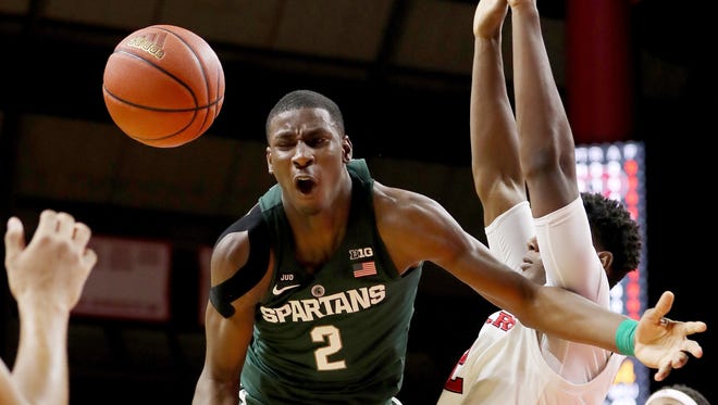 Jaren Jackson Jr. (2) of the Michigan State Spartans loses the ball as Shaquille Doorson (2) of the Rutgers Scarlet Knights defends in the second half.