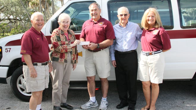 Indian River Estates East Residents Association board members Tom Hamilton, left, and Jane Brown present a $2,500 donation to Indian River County Volunteer Ambulance Squad board members Clark Ballard, Art Eberhart, and Desiree Felger.