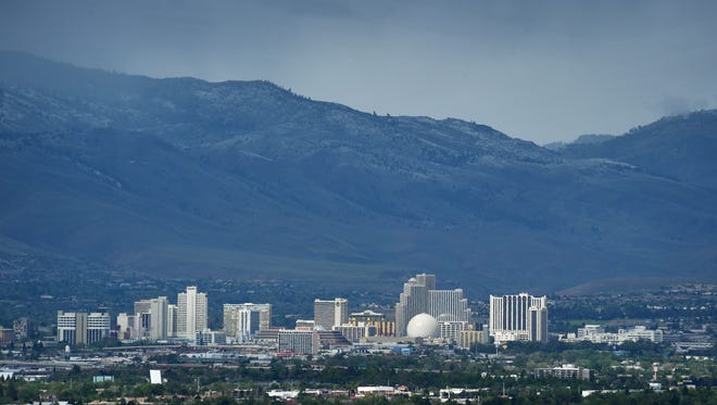 A storm brings rain and snow to the city of Reno on May 7, 2015.