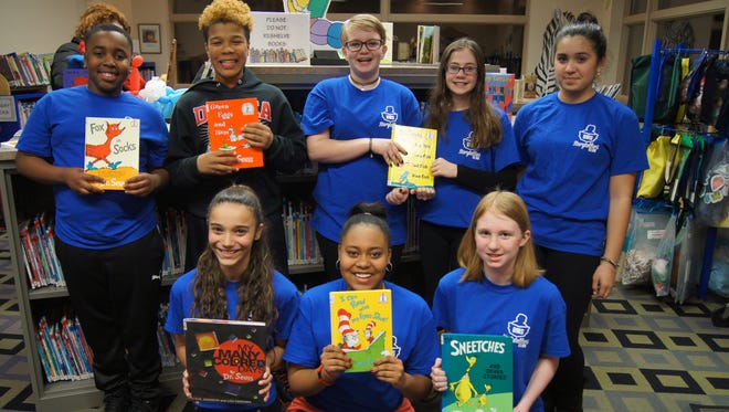 Delsea Regional Middle School Storytellers Club members (front row, from left) Kayla Lawson, Jordan Jones, Candice Rauchfuss; and (back row, from left), Jaden McSeed, Christopher Motter, Mikaela Gieswein, Ceirra Hoeger and Monserrat Inzunza-Barria, shared Dr. Seuss stories with children who attended story time at Franklin Township Library.